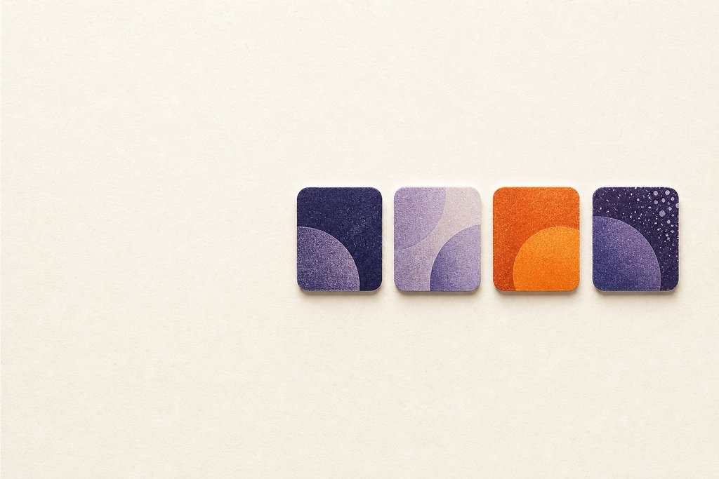 Abstract artwork of a short row of four rounded letter tiles, one in tangerine ember